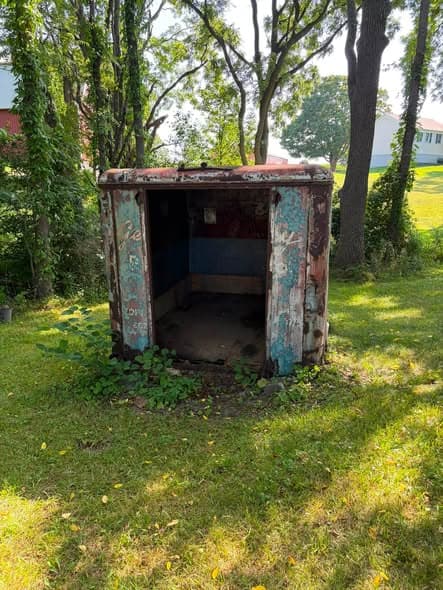 Rusted collapsing outbuilding before demolition and removal