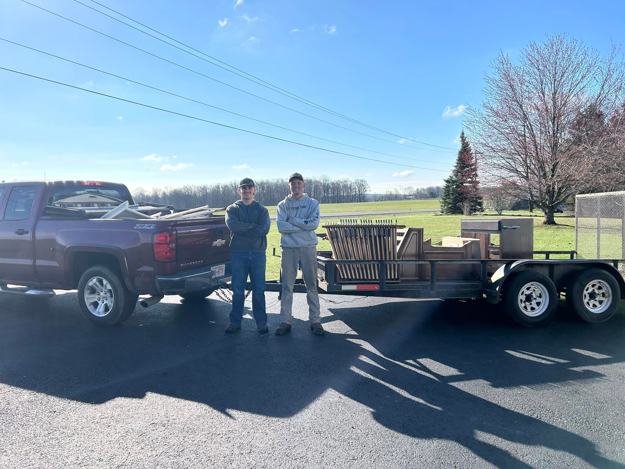 JW and crew standing with the Midlakes truck and a loaded trailer