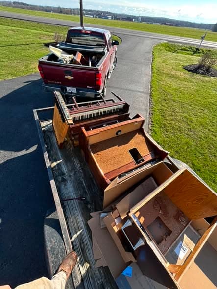 Trailer loaded with dressers and cabinets hauled away for disposal