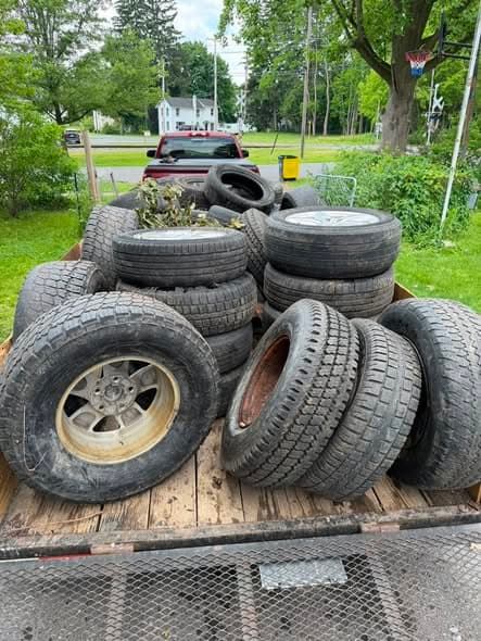 Trailer loaded with old tires hauled away for disposal